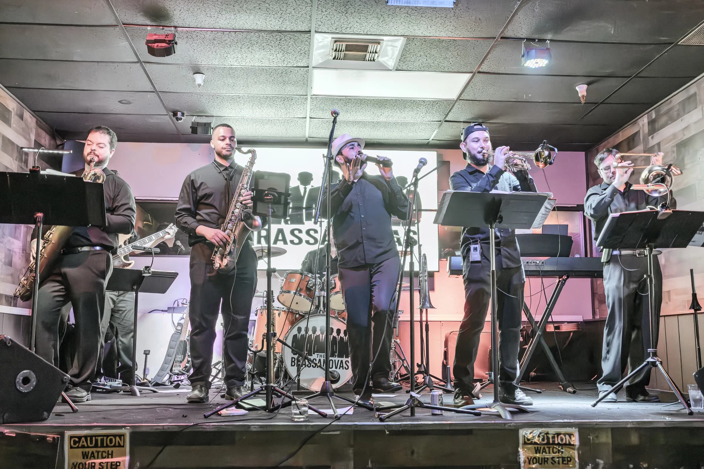 Members of The Brassanovas performing together onstage