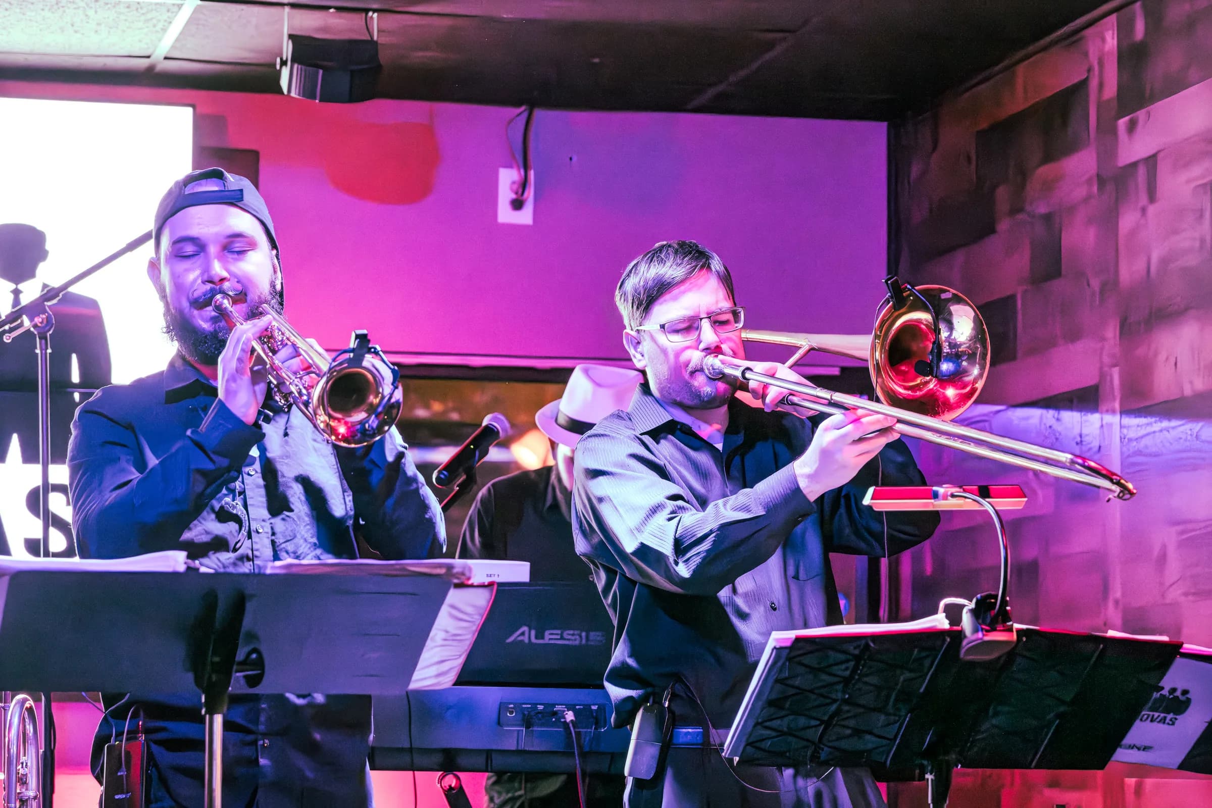 Members of The Brassanovas’ horn section performing live