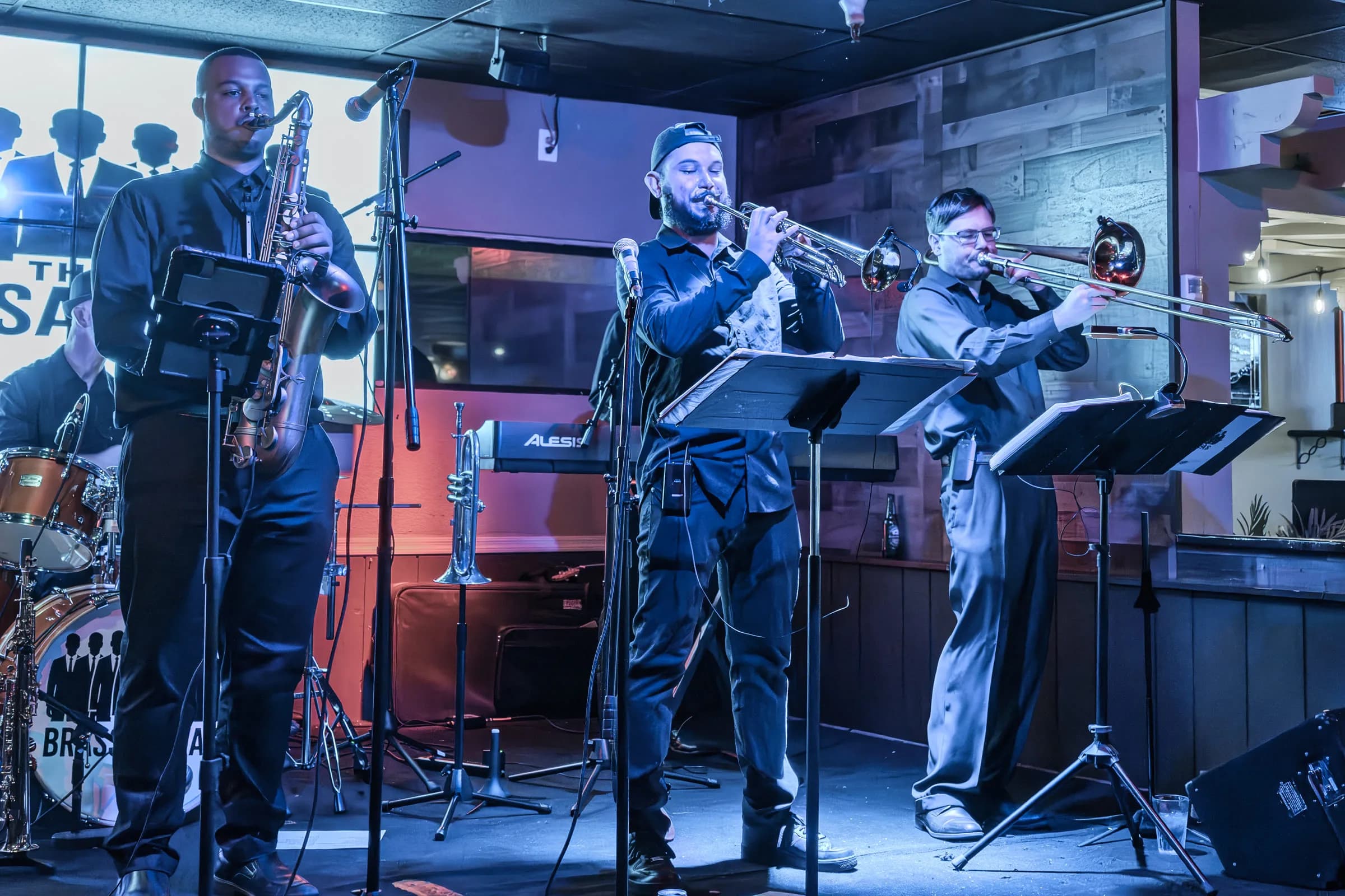 The Brassanovas horn section playing together onstage