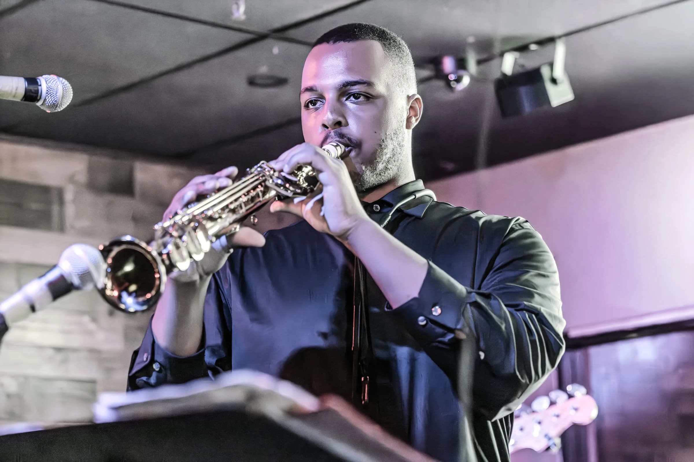 A saxophone player from The Brassanovas performing live