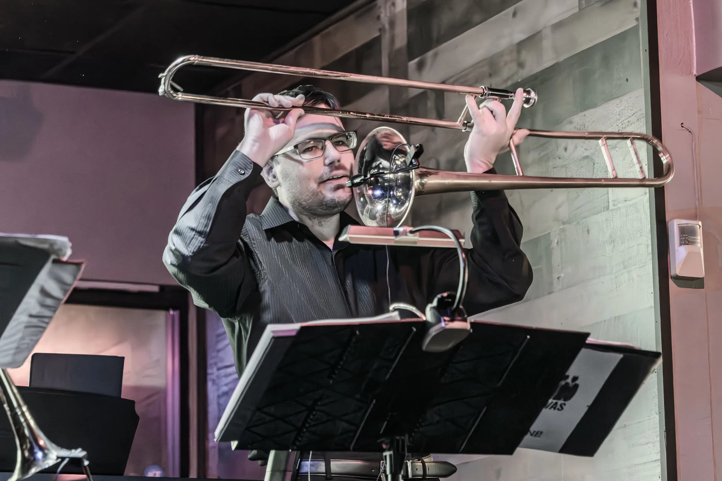 A trombone player from The Brassanovas performing live