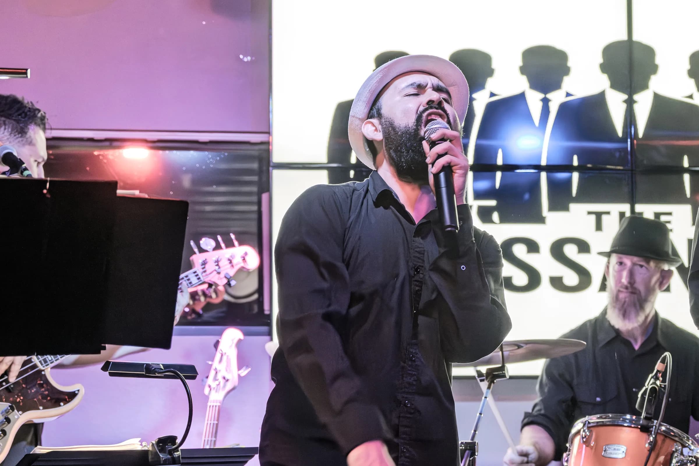 A vocalist from The Brassanovas performing live