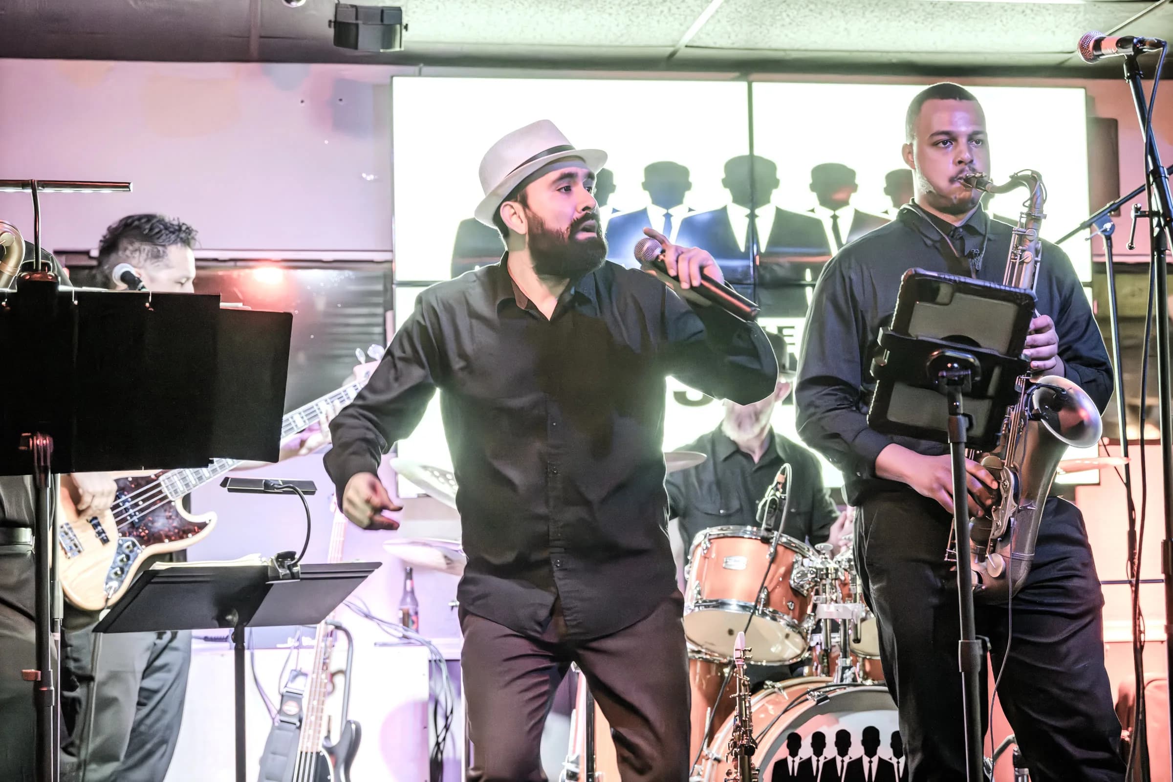 A vocalist and saxophonist from The Brassanovas performing together with the rhythm section